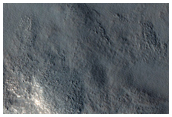 المكونات الصخرية المتنوعة فى الارتفاع المركزى لفوّهة  ستوكس  (Stokes Crater)