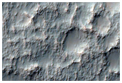 Possible Dikes on Crater Floor Near Sirenum Fossae