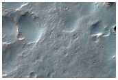 Intercrater Channels and Light-Toned Exposures South of Saheki Crater