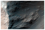 Low Albedo Slopes along Coprates Chasma Ridge