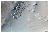 Low Albedo Feature Around Impact Crater