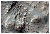 Light-Toned Material Exposed in Southern Mid-Latitudes