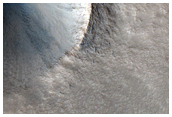 Crater Among Pits on Northern Plains