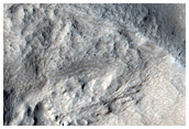 Ejecta Flow over and around Pre-Existing Obstacles