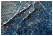 Low Albedo Area in Northern Nilosyrtis Region Crater