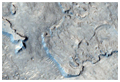 Layers in Eroded Crater Southwest of Bamberg Crater