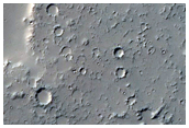 Lava Flow Spilling Over Crater Wall Onto Crater Floor in Daedalia Planum
