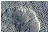 Crater Near Ice-Exposing Impacts