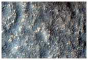 Curved Channel in Lyot Crater
