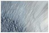 Evidence of Ice and Rock in Crater Near Side Channel of Mamers Valles