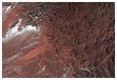 Mantled Crater Near Bosporos Rupes