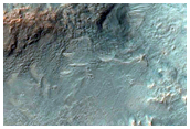 Vari esemplari di roccia in un cratere di Tyrrhena Terra