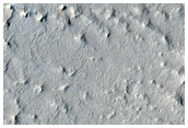 Layered Terrain and Crater Ejecta Deposits in Arabia Terra