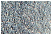 Crater with Exposed Layers in Northern Plains