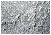 Channels Cut through Small Crater and Down Large Crater Wall