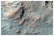 Well-Exposed Layered Bedrock on Crater Floor in Terra Sabaea