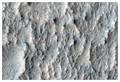 Olivine-Rich Crater Floor East of Charybdis Scopulus