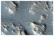 Hebrus Valles Collapse and Raised Features