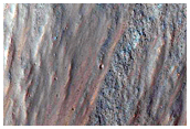 Disrupted Crater Near Ophir Chasma