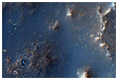 Channels on Degraded Impact Basin Rim