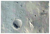 Secondary Crater Chain Scours North of Highly Collapsed Complex Crater