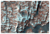 Dunes Marching Across Well-Preserved Crater Ejecta