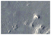 Flat Topped Sinuous Ridges and Superposition on Circular Feature