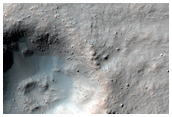 Crater with Dark Night-Infrared Ejecta Blanket in Daedalia Planum