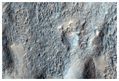 Contact between Isidis Planitia Olivine-Rich Unit and Ejecta of Crater