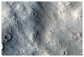 Pettit Crater Ejecta in Contact with Knobs and Massifs