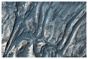 Convoluted Folds in Light-Toned Sulfates along Ius Chasma Floor