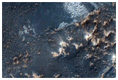 Light-Toned Deposits within Noctis Labyrinthus Graben