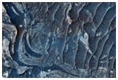 Convoluted Folds in Light-Toned Deposits along Ius Chasma Floor