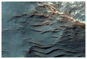 Basin with Light-Toned Rock Exposures and Valley Network Features