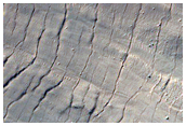 Monitor Steep Slopes of Asimov Crater