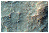 Light-Toned Deposits along Ladon Valles Basin Floor