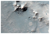 Outcrops in Pitted Plains Unit Northwest of Hellas Region