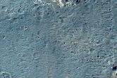 Light-Toned Layered Deposits along Ius Chasma Plateau
