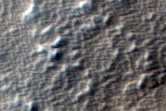 Impact Crater on Ridged Margin of Arsia Mons
