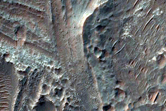 Layered Deposits in Central Pit of Large Crater
