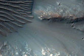 Impact Crater Exposing Bedrock
