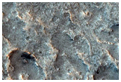 Pitted Surface around Crater in Idaeus Fossae Region
