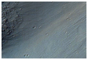 Light-Toned Hydrated Deposits within Ius Chasma
