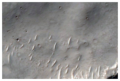 Bakhuysen Crater Ejecta with Mounds and Unit Contacts
