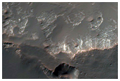 Light-Toned Material in Crater South of Holden Crater
