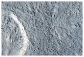 Glacial Ridges Near Mound in Moreux Crater
