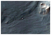 Dark-Toned Deposits on Floor of Blunck Crater
