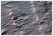 Layered and Fan Material in Crater in Tyrrhena Terra
