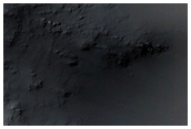 Flow over Crater Rim in Daedalia Planum
