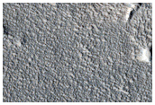 Extended Thermally Bright Ejecta and Dome
